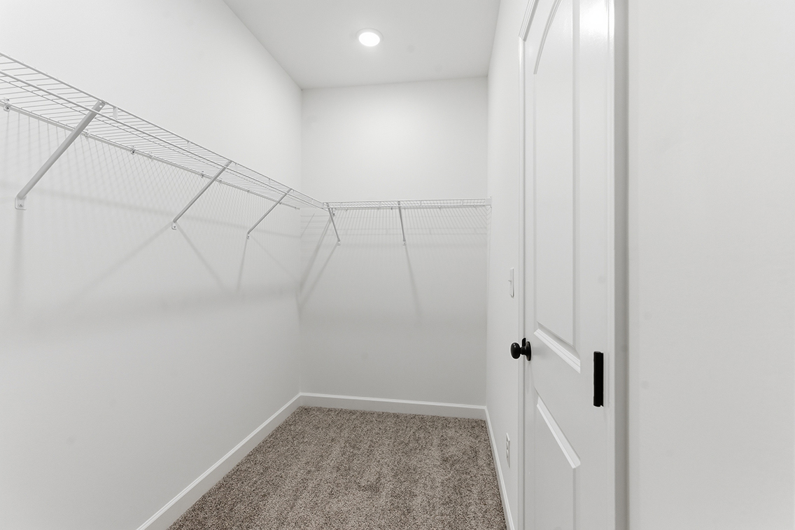 A hallway with white walls.