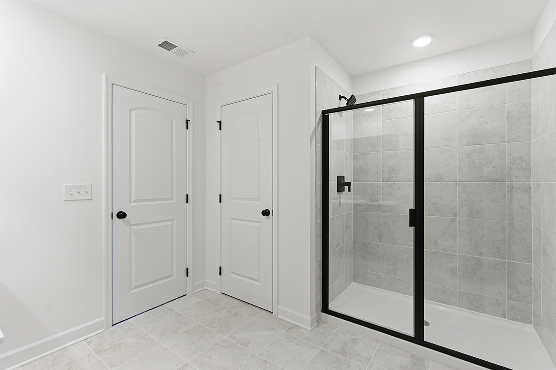 A bathroom with a glass shower.
