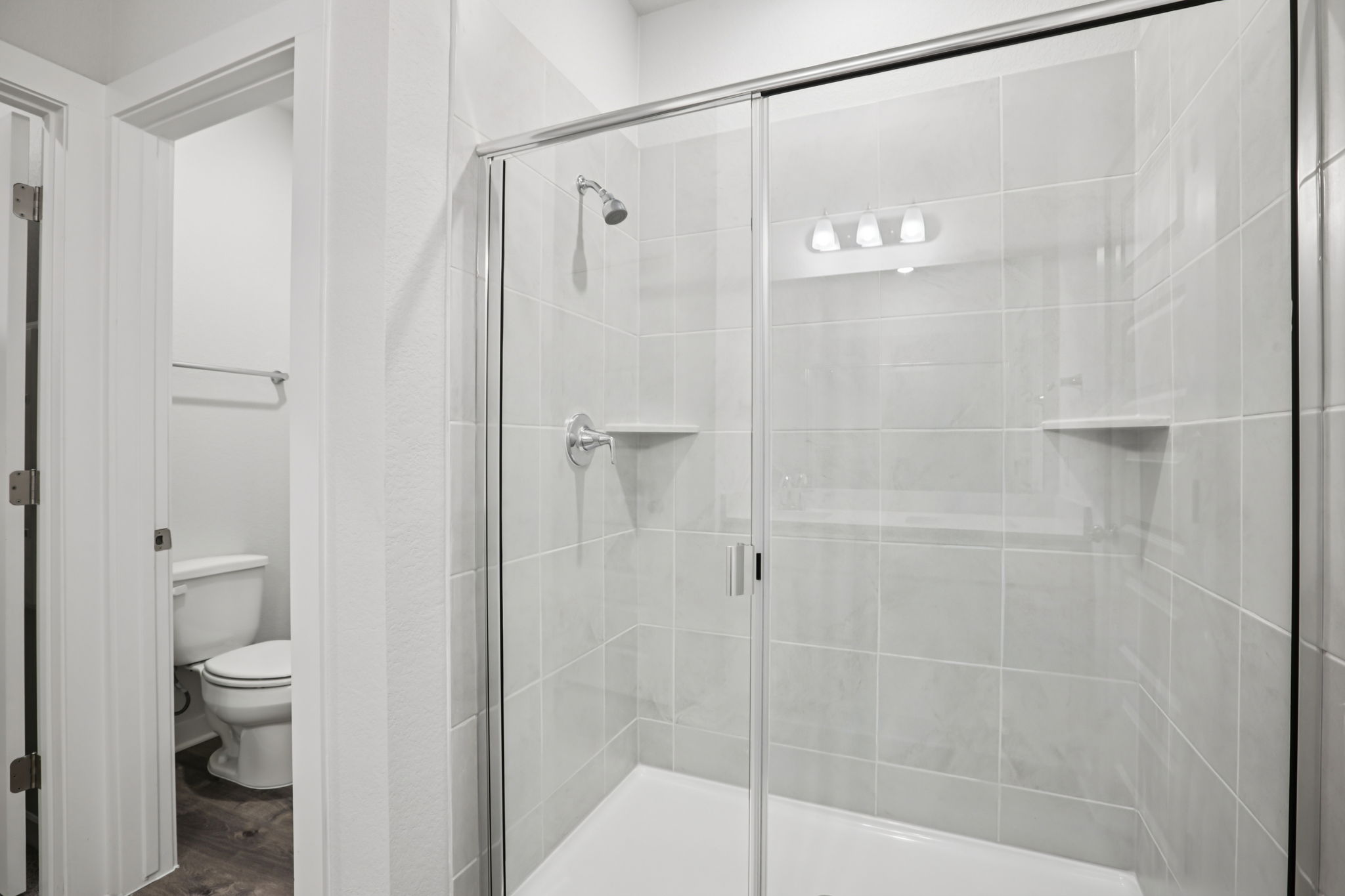 A bathroom with a glass shower.