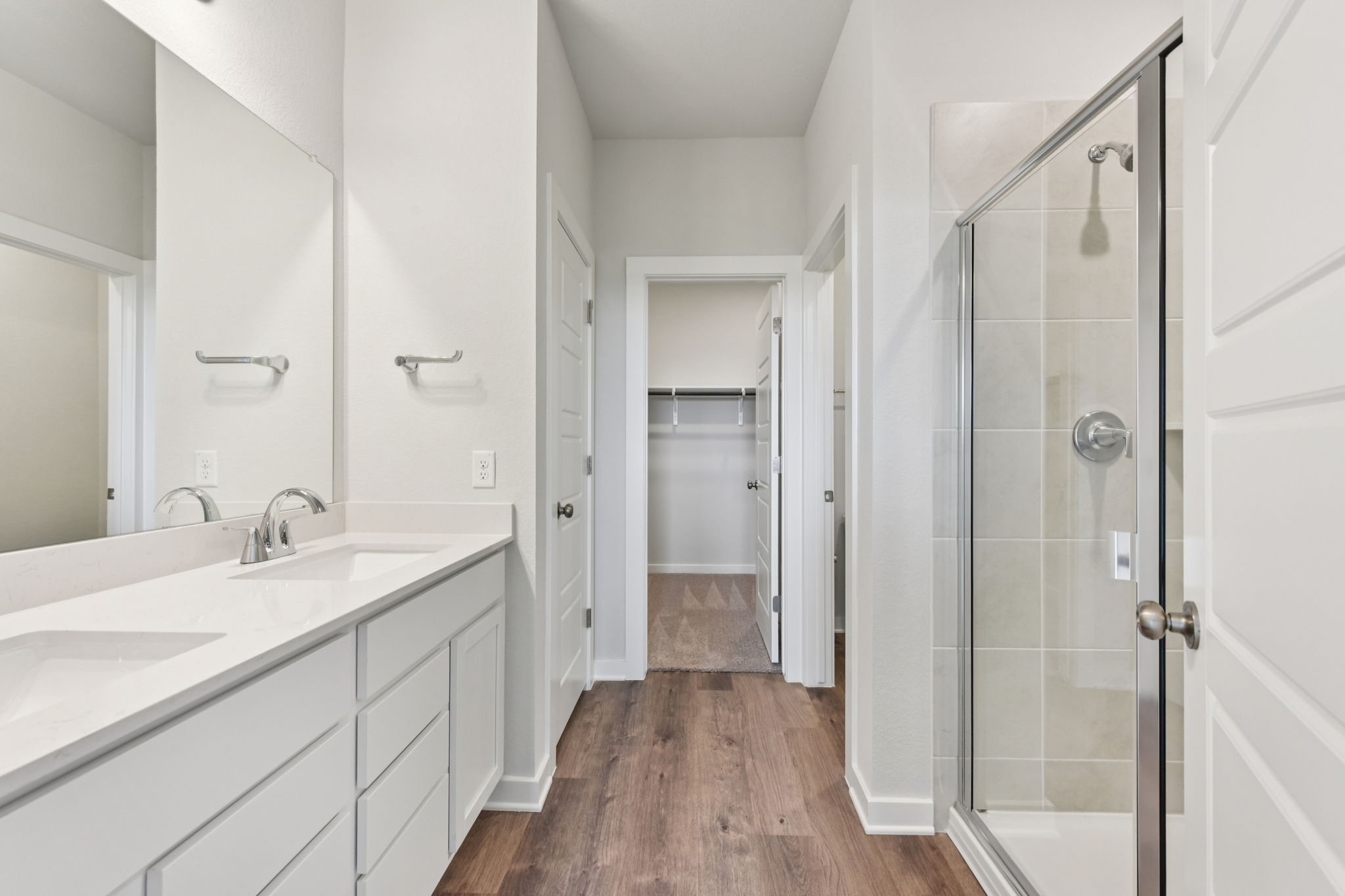 A bathroom with a glass shower.