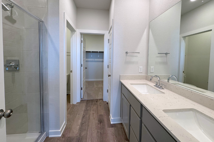 A bathroom with a glass shower.