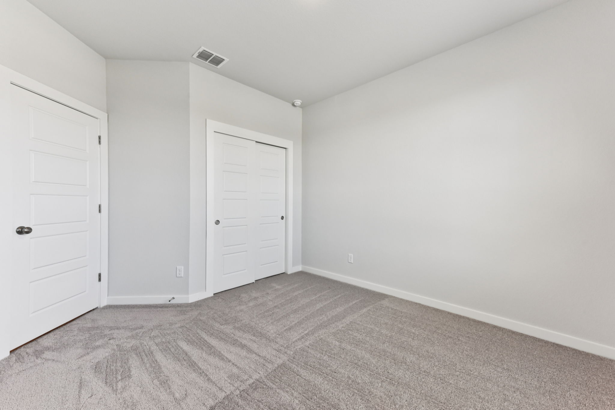 A room with white doors.