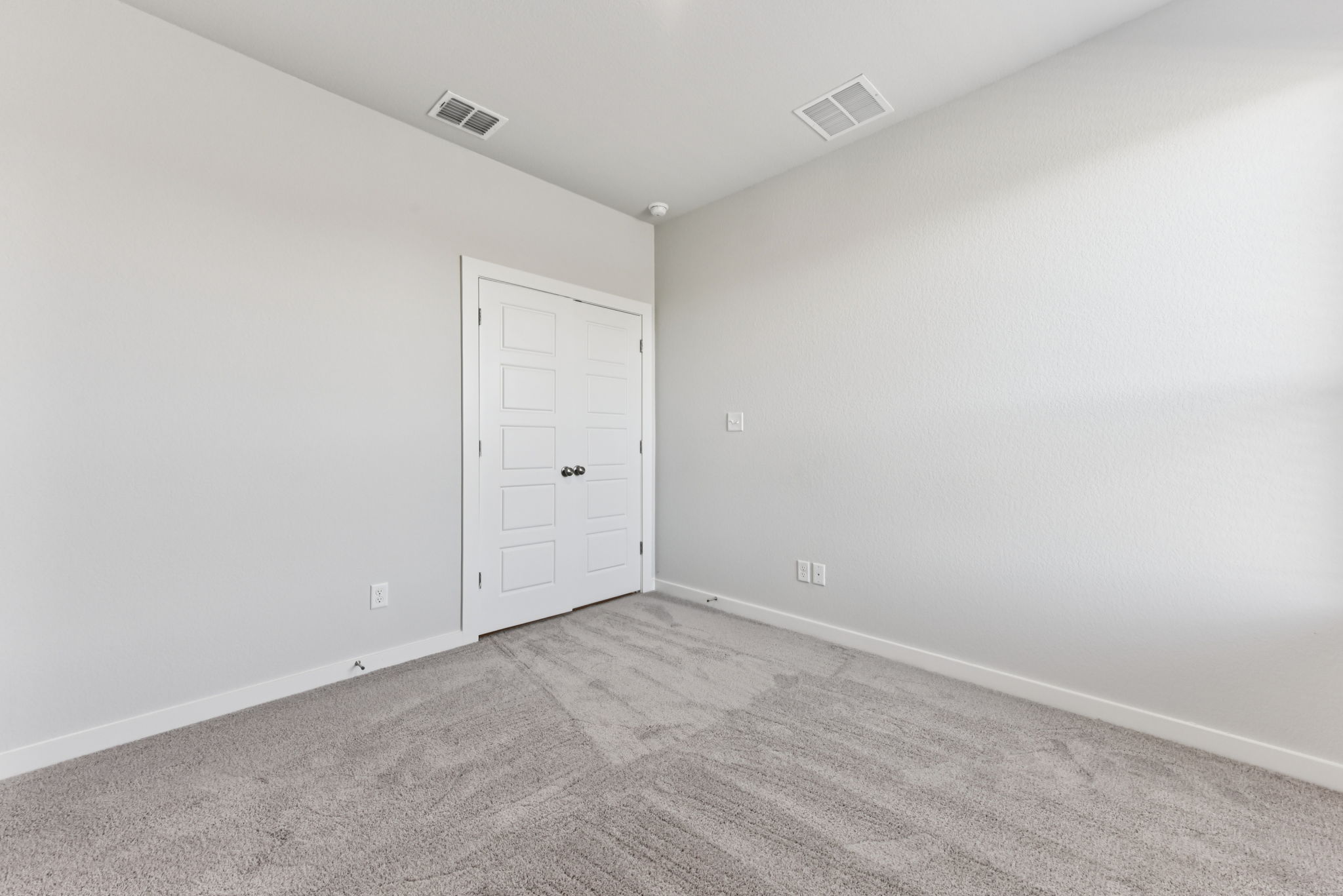 A room with white doors.