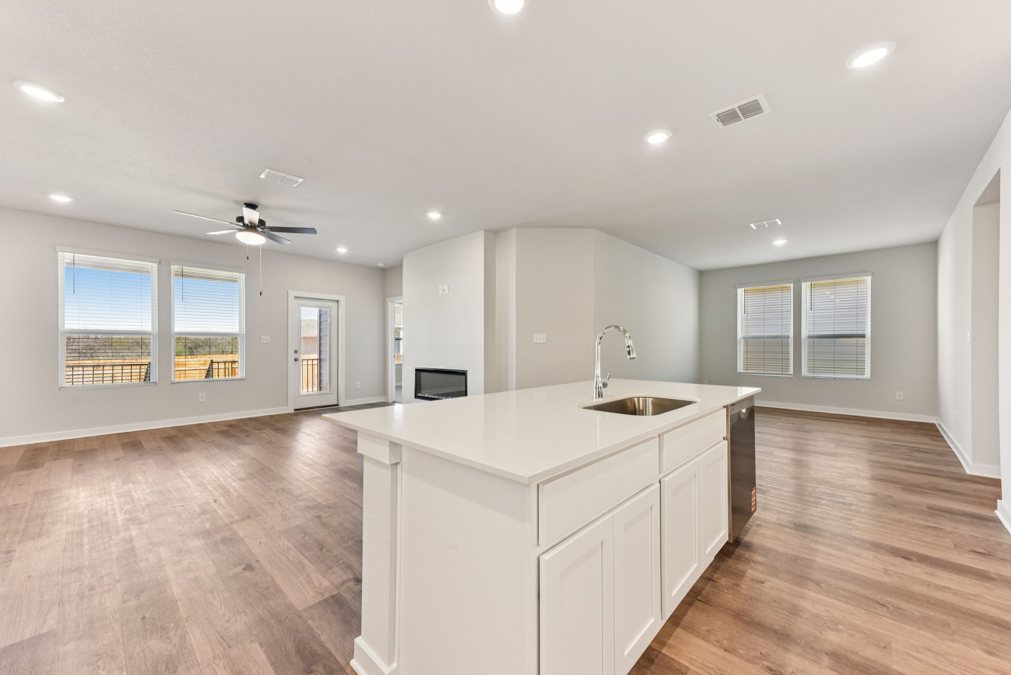 A kitchen with white cabinets.