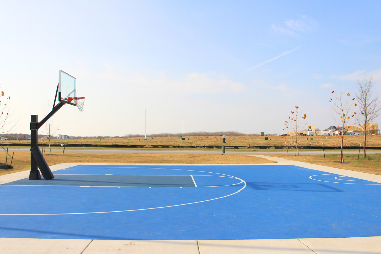 A basketball court with a basketball hoop.