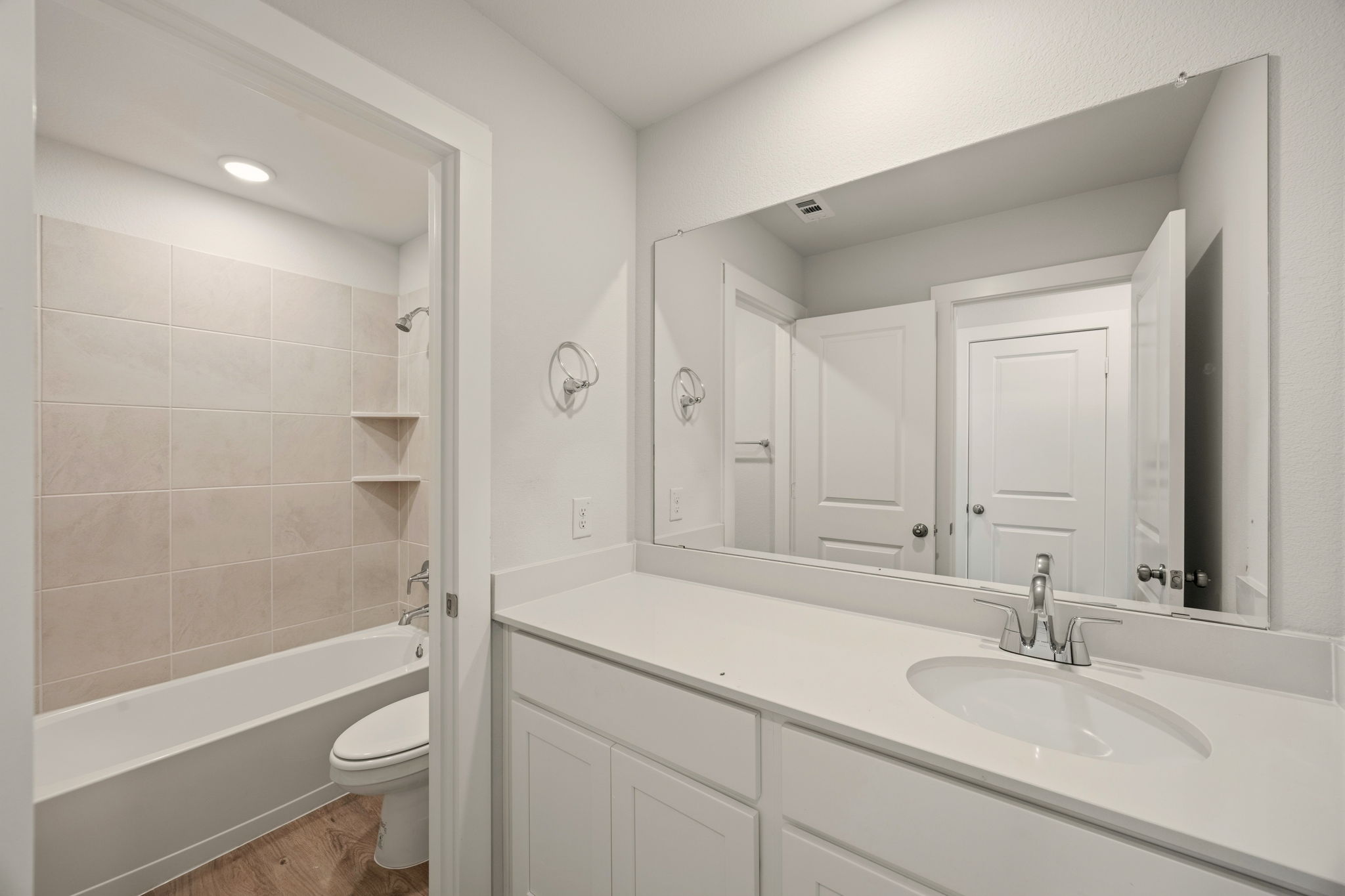 A bathroom with a sink and a toilet.