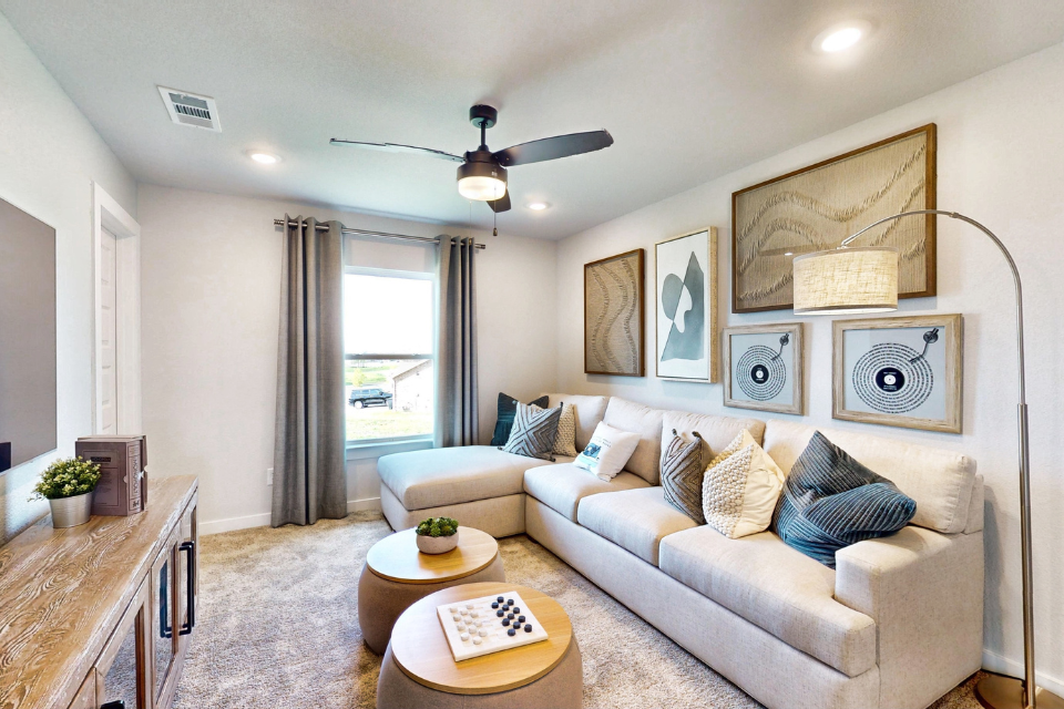 A living room with a couch and a table.