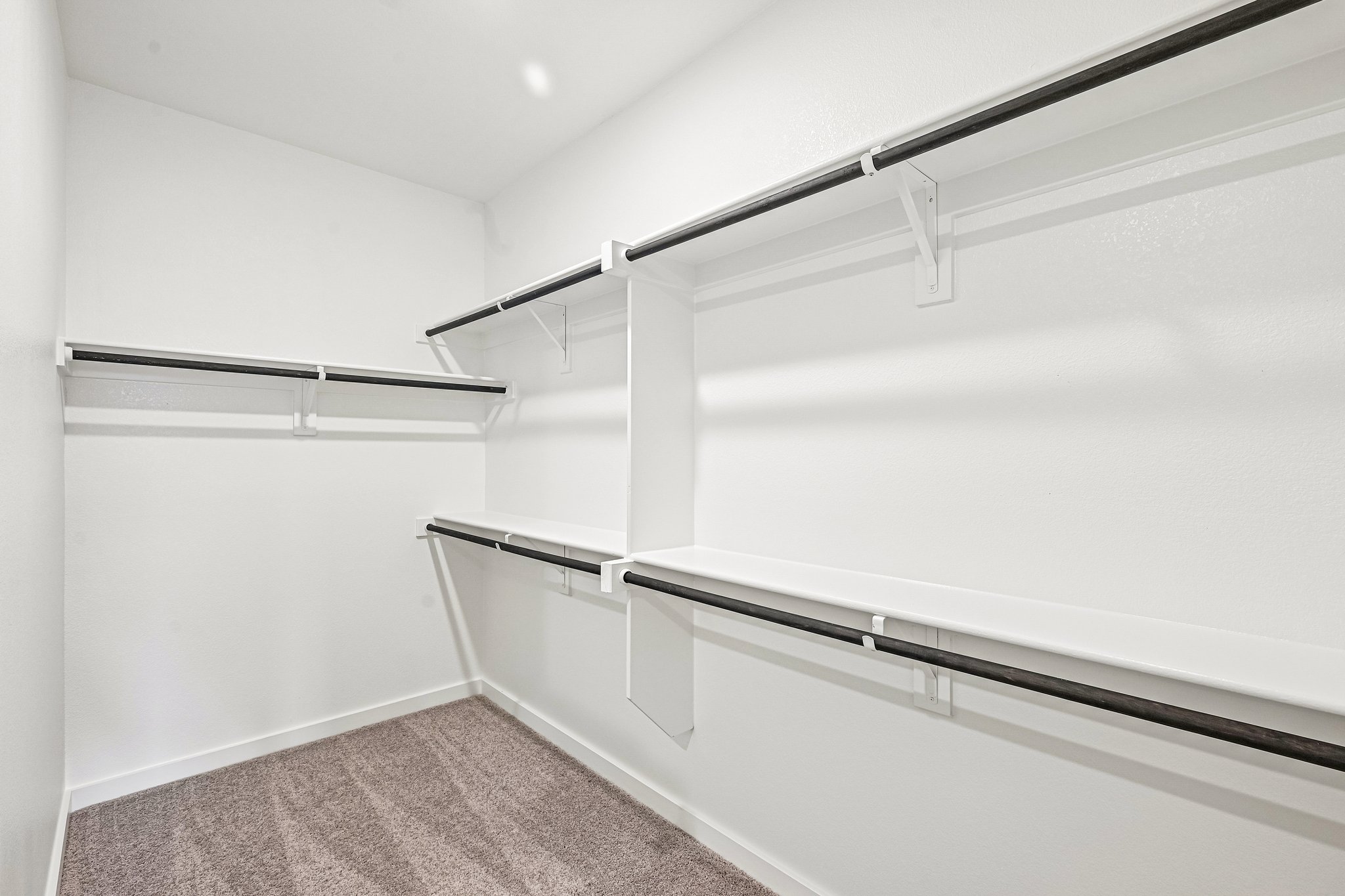 A white room with a staircase.
