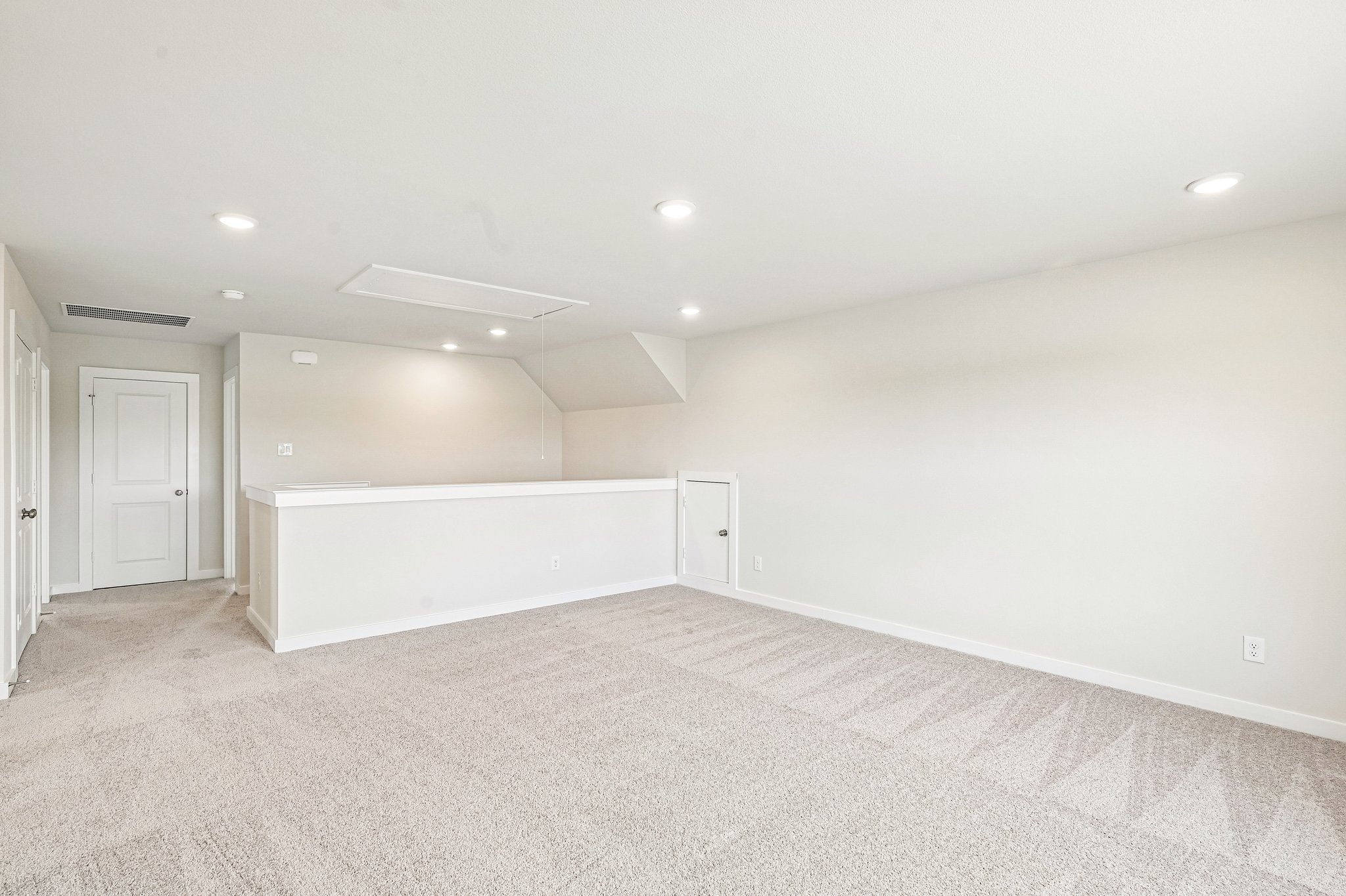 A room with white walls and a white cabinet.