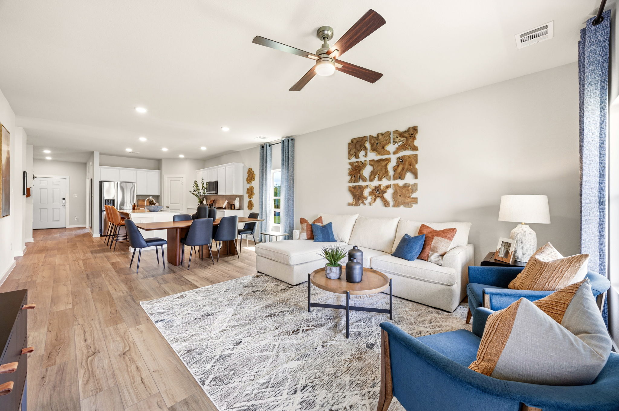 A living room with a wood floor.
