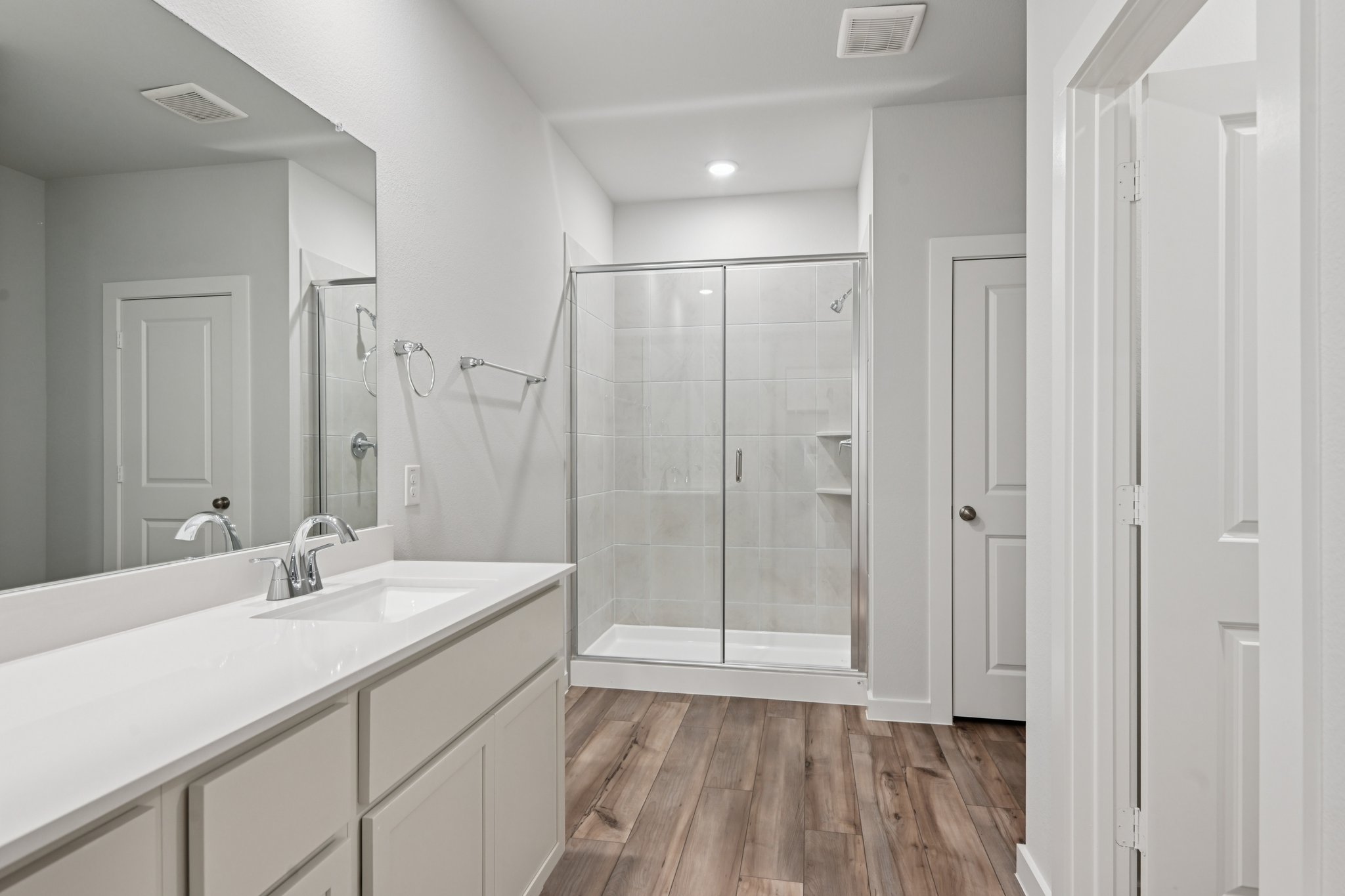 A bathroom with a glass shower.