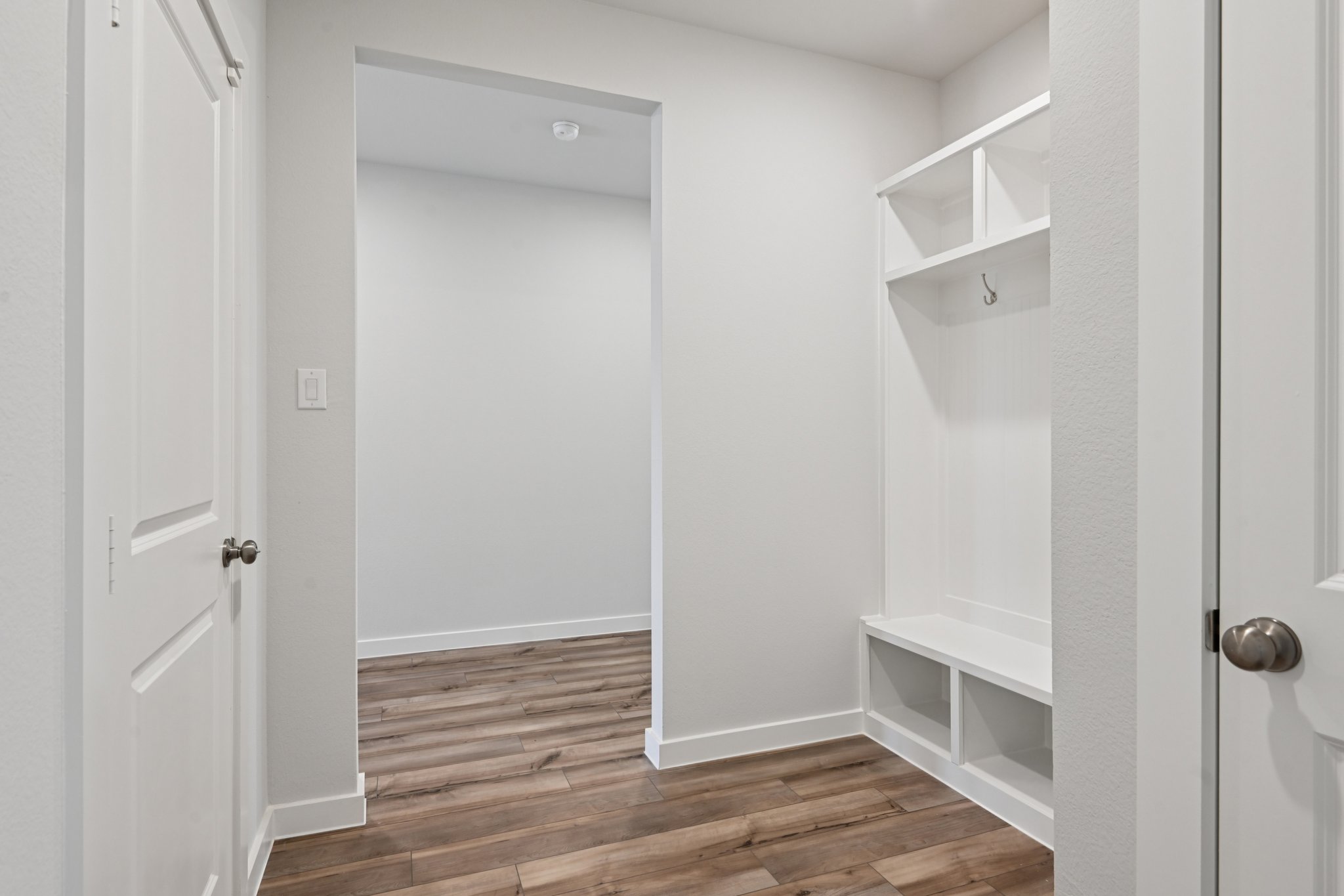 A bathroom with white walls.