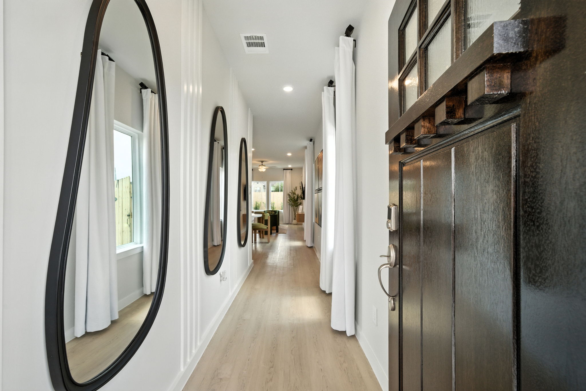 A hallway with white walls.