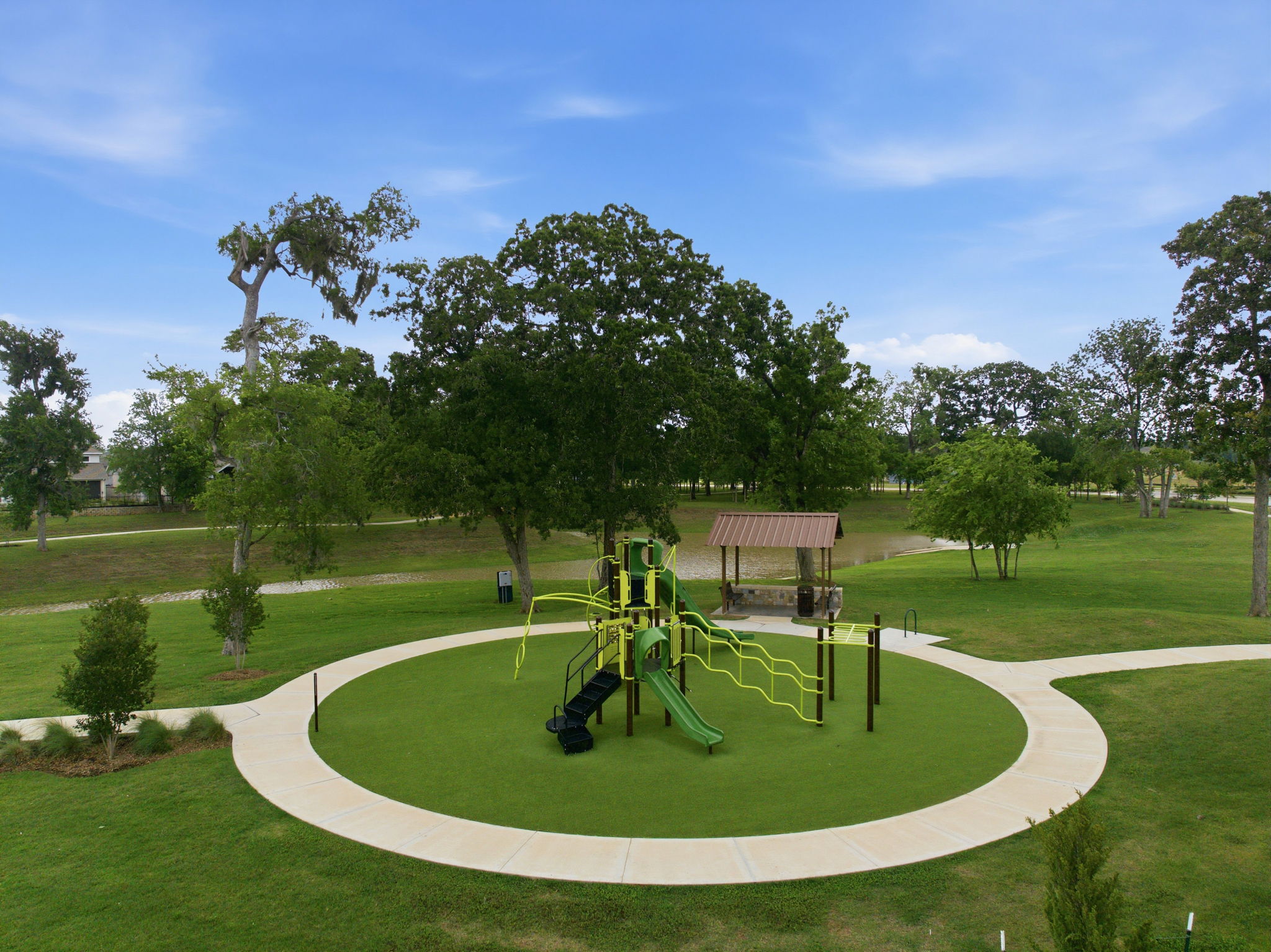 A playground with trees and grass.