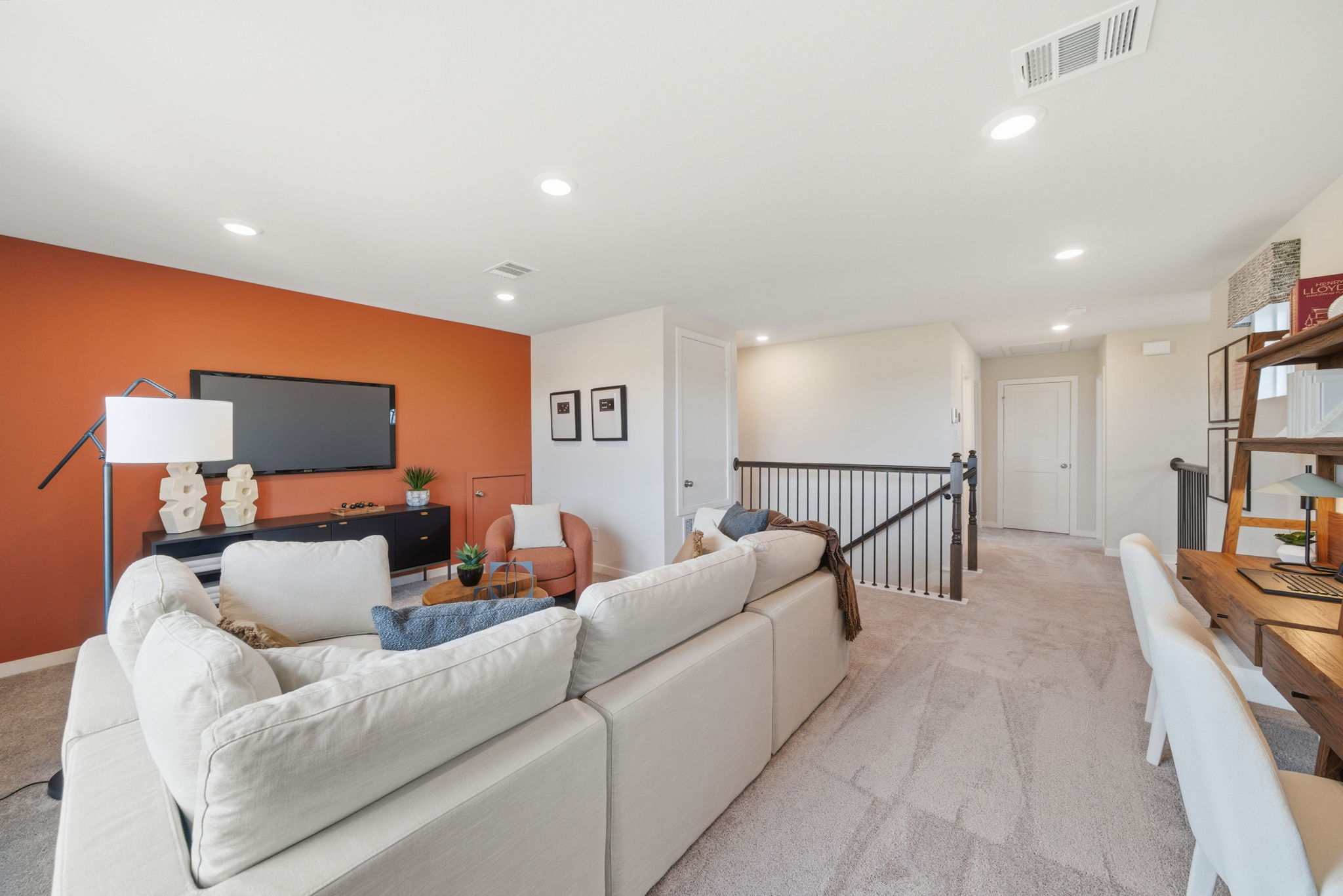 A living room with a couch and a tv.