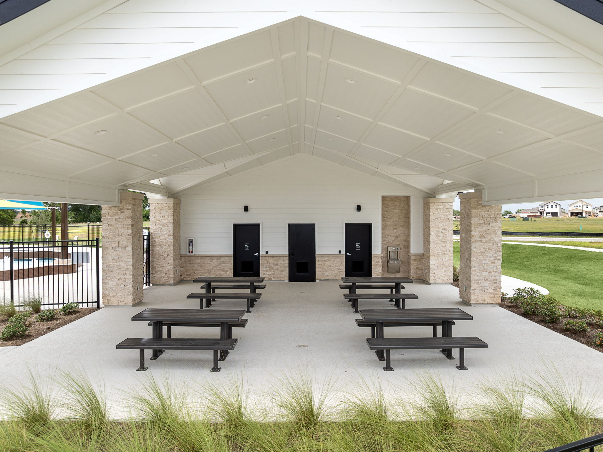 A building with benches and a covered area.