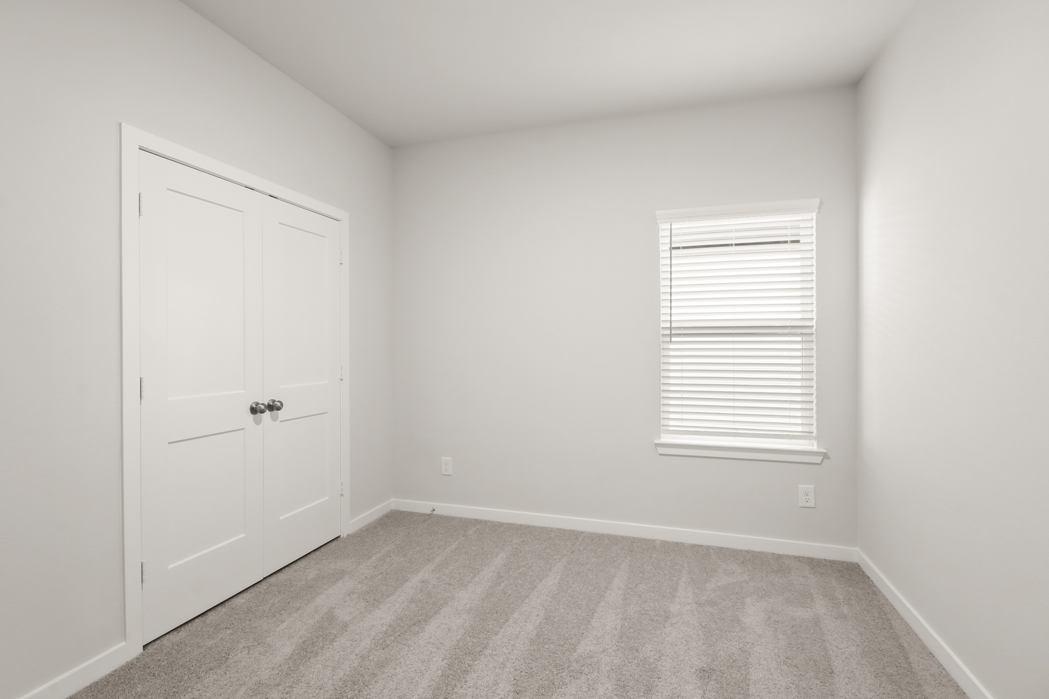 A room with white doors.