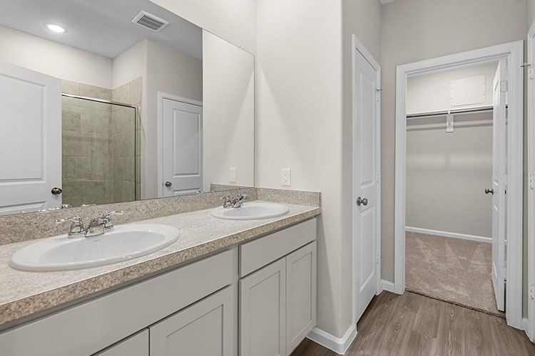 A bathroom with a large mirror.