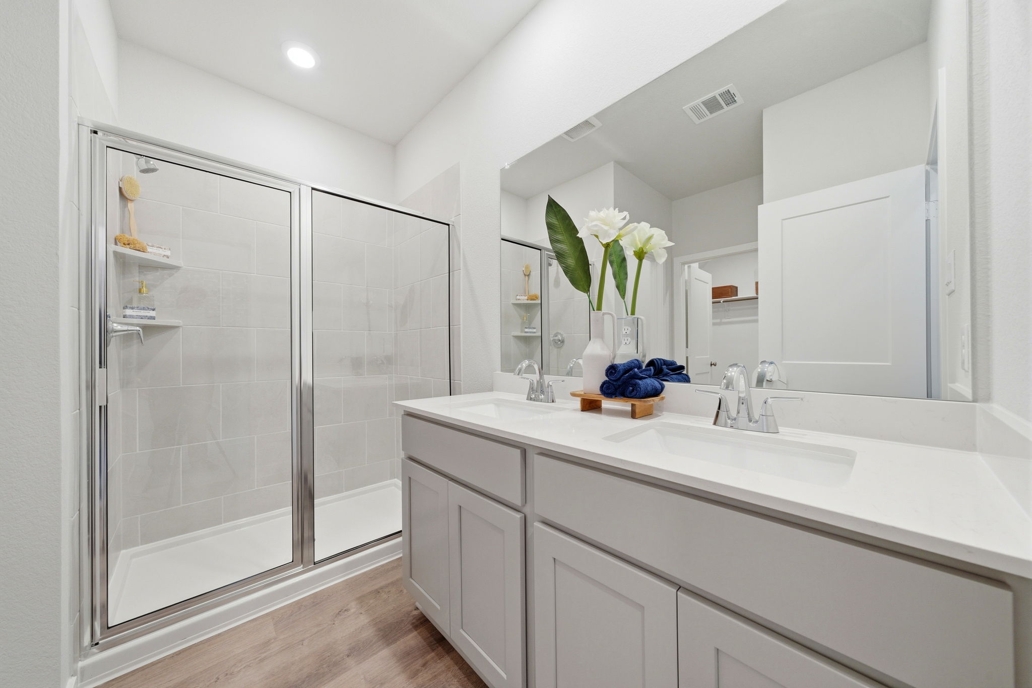 A bathroom with a glass shower.