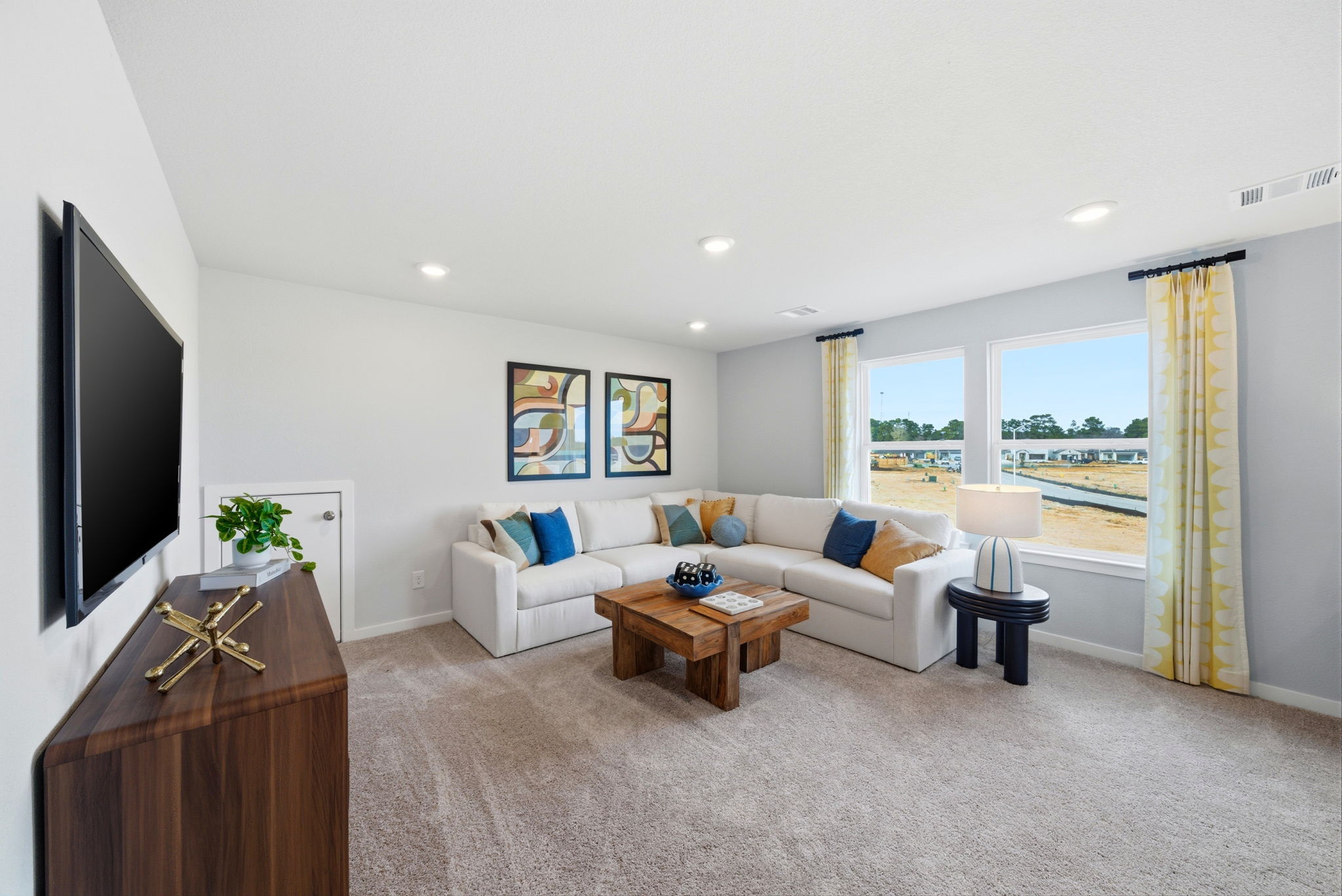 A living room with a tv and a couch.