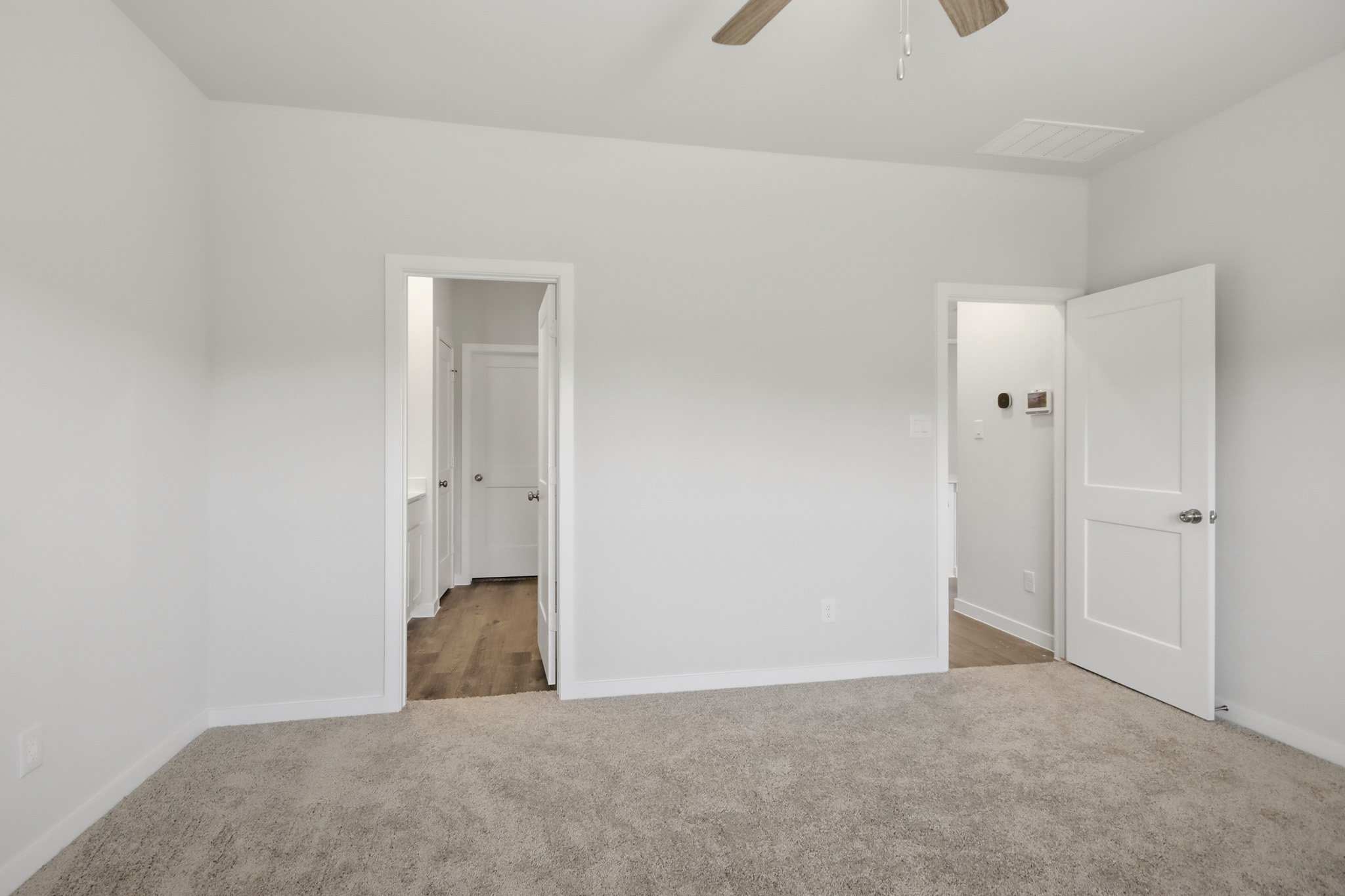 A room with white doors.