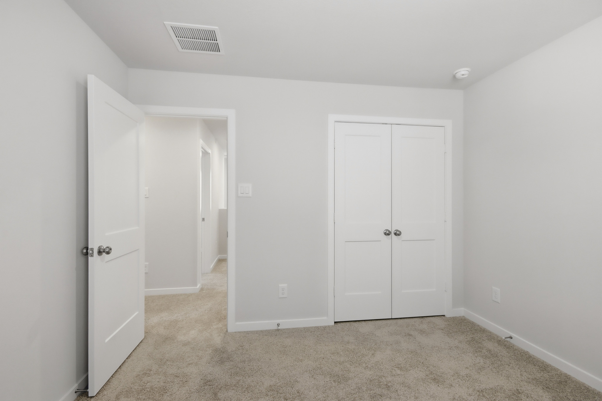 A room with white doors.
