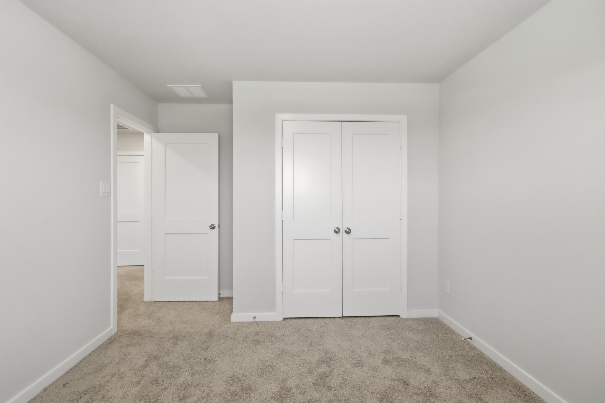 A room with white doors.