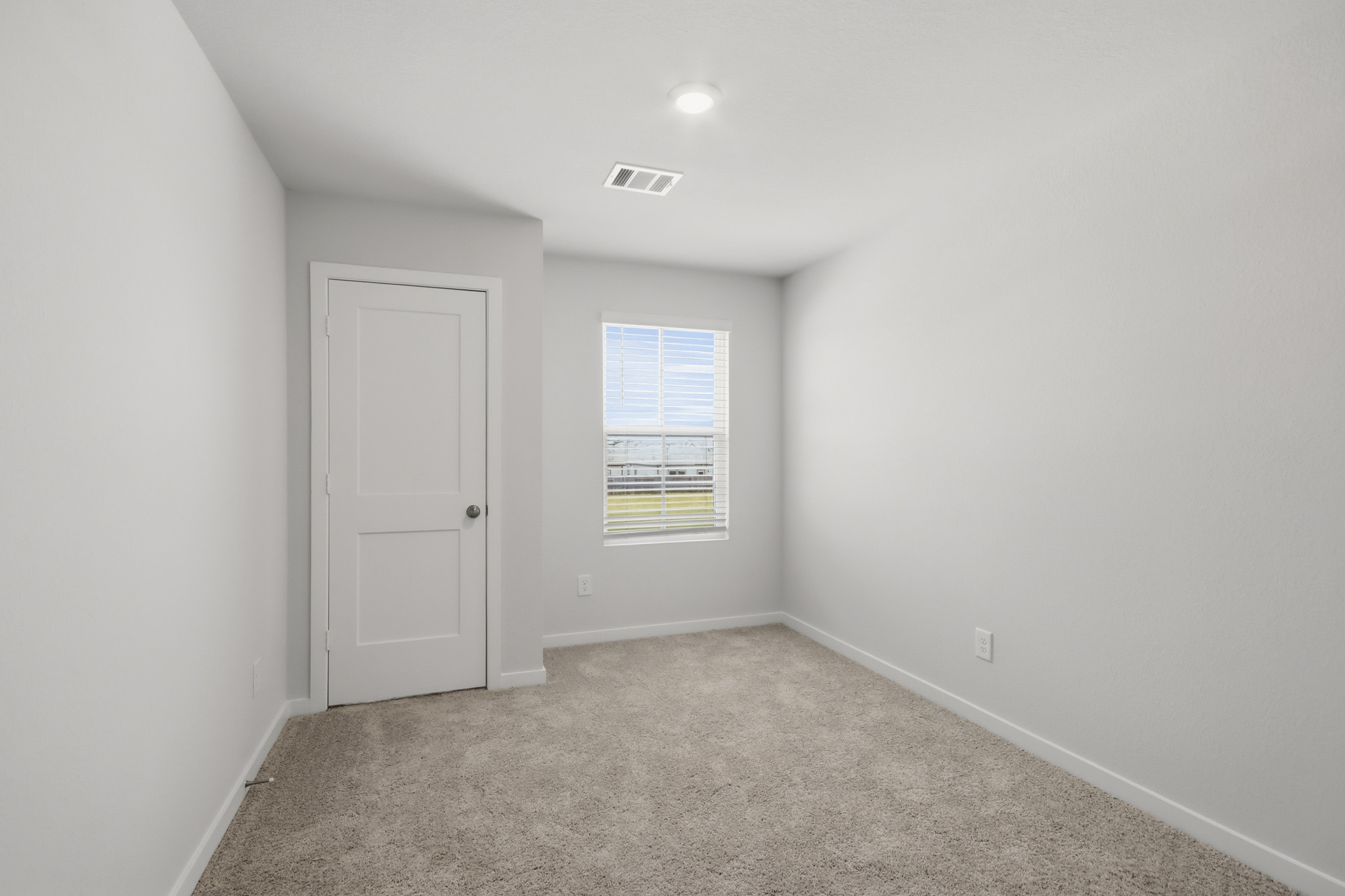 A room with a door and a window.