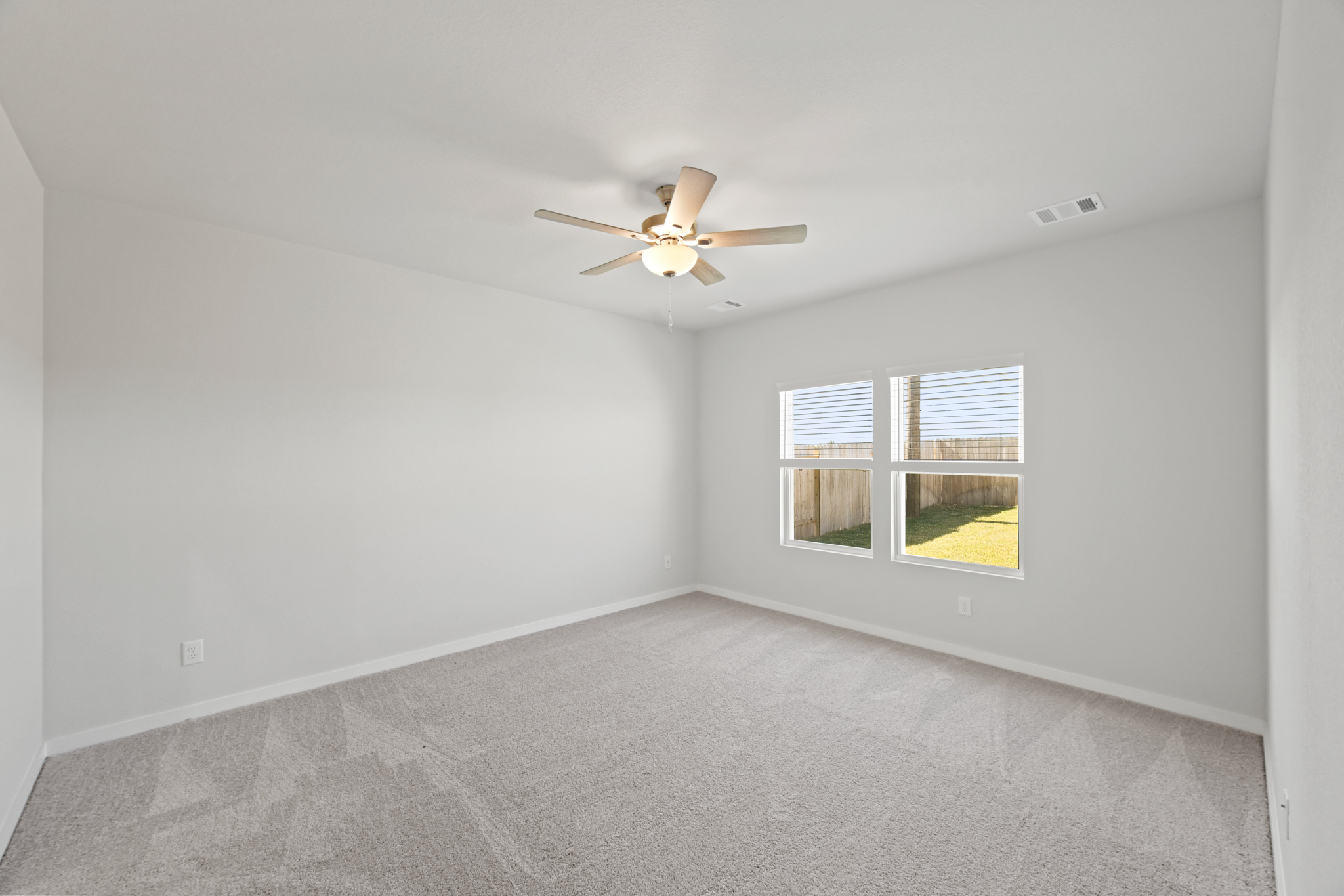 A ceiling fan in a room.