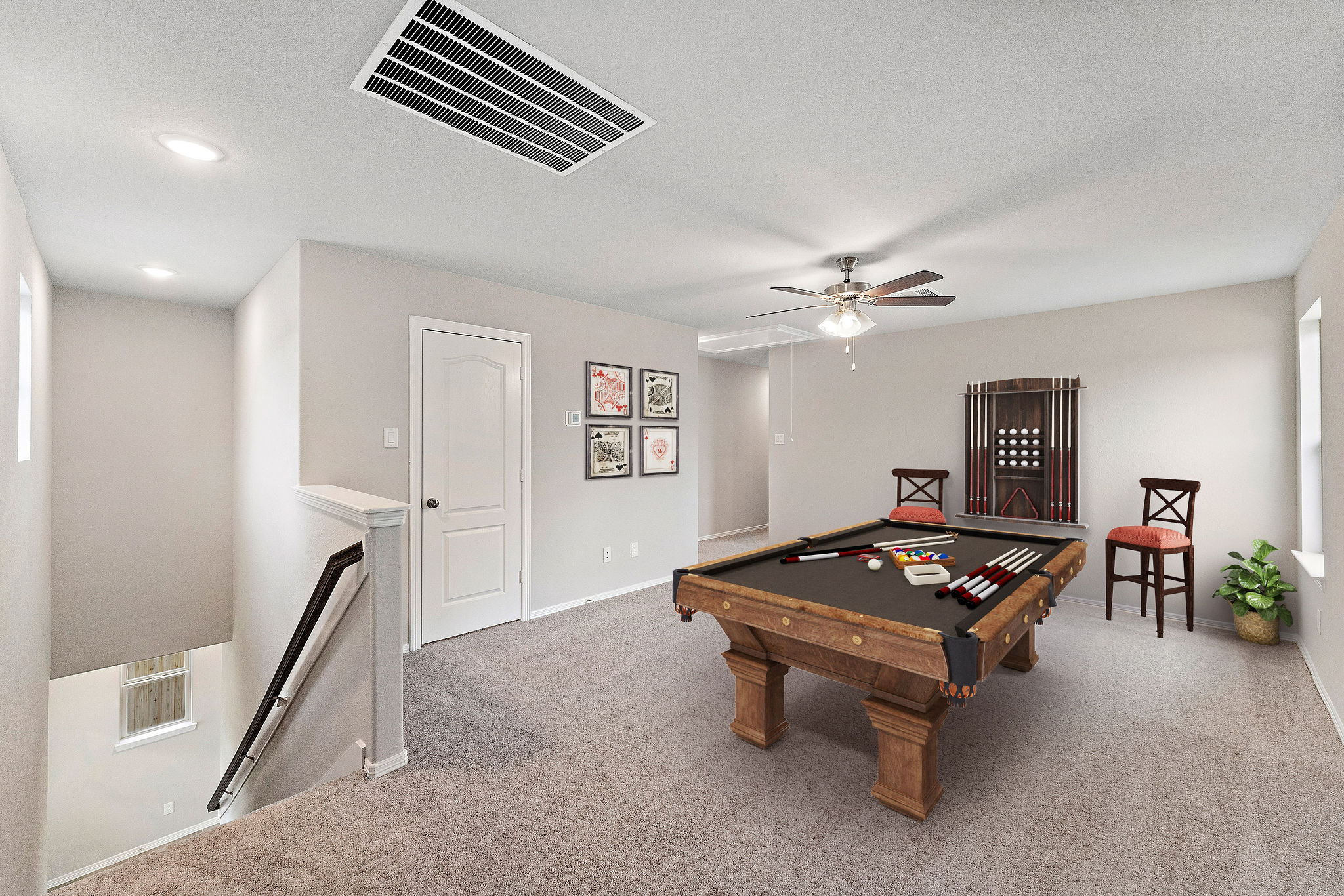 A room with a table and chairs.