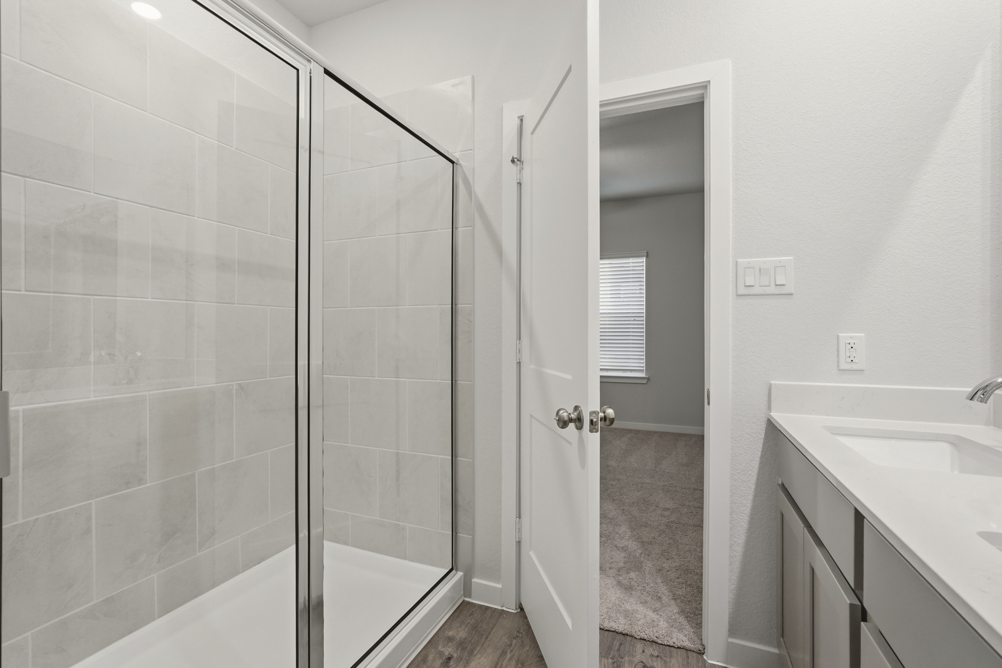 A bathroom with a glass shower.