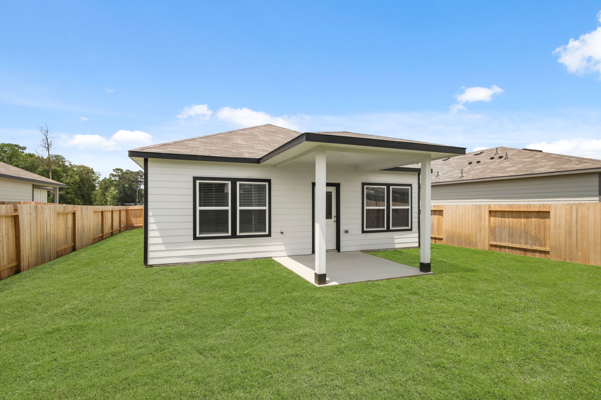 A house with a grass yard.
