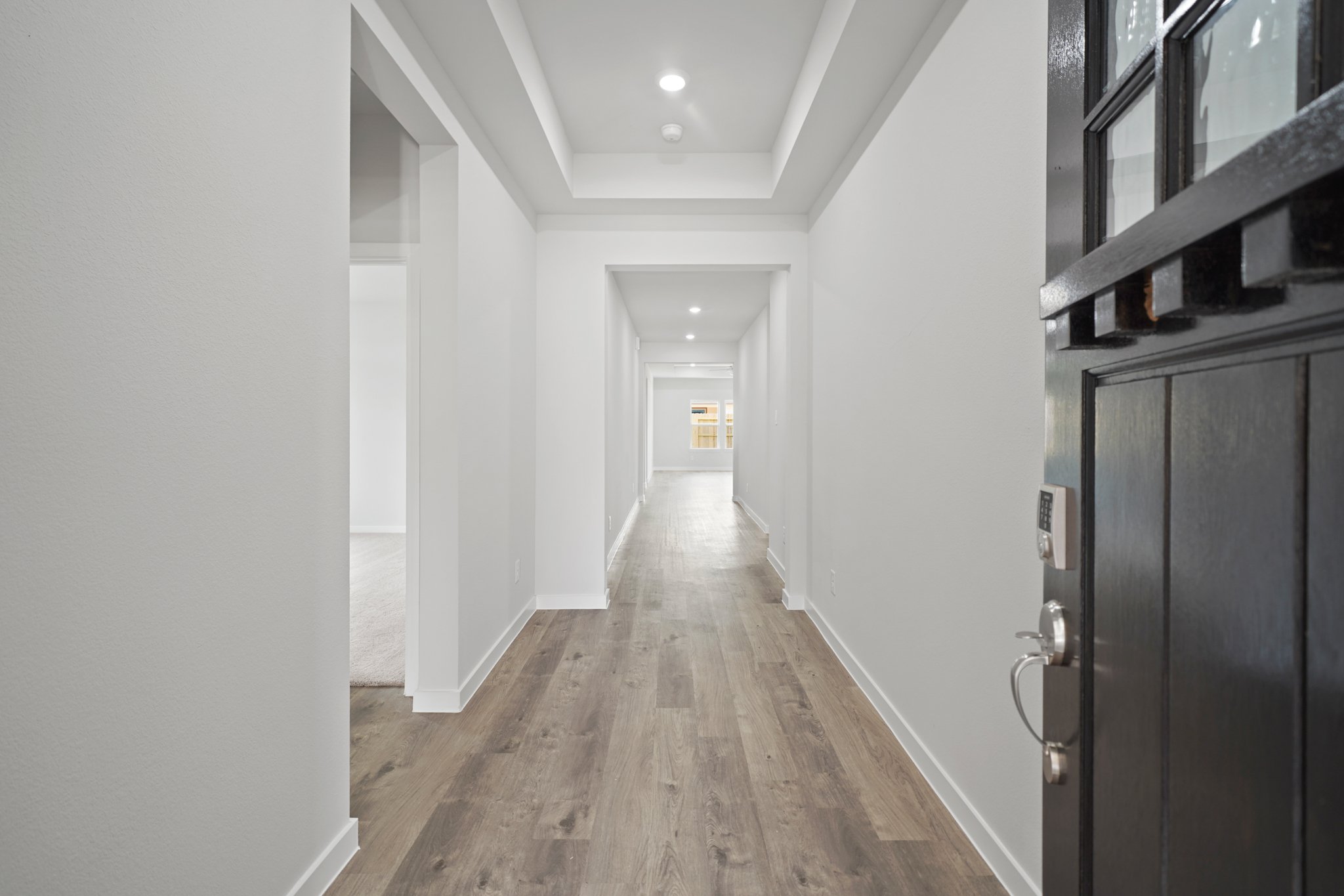 A hallway with white walls.