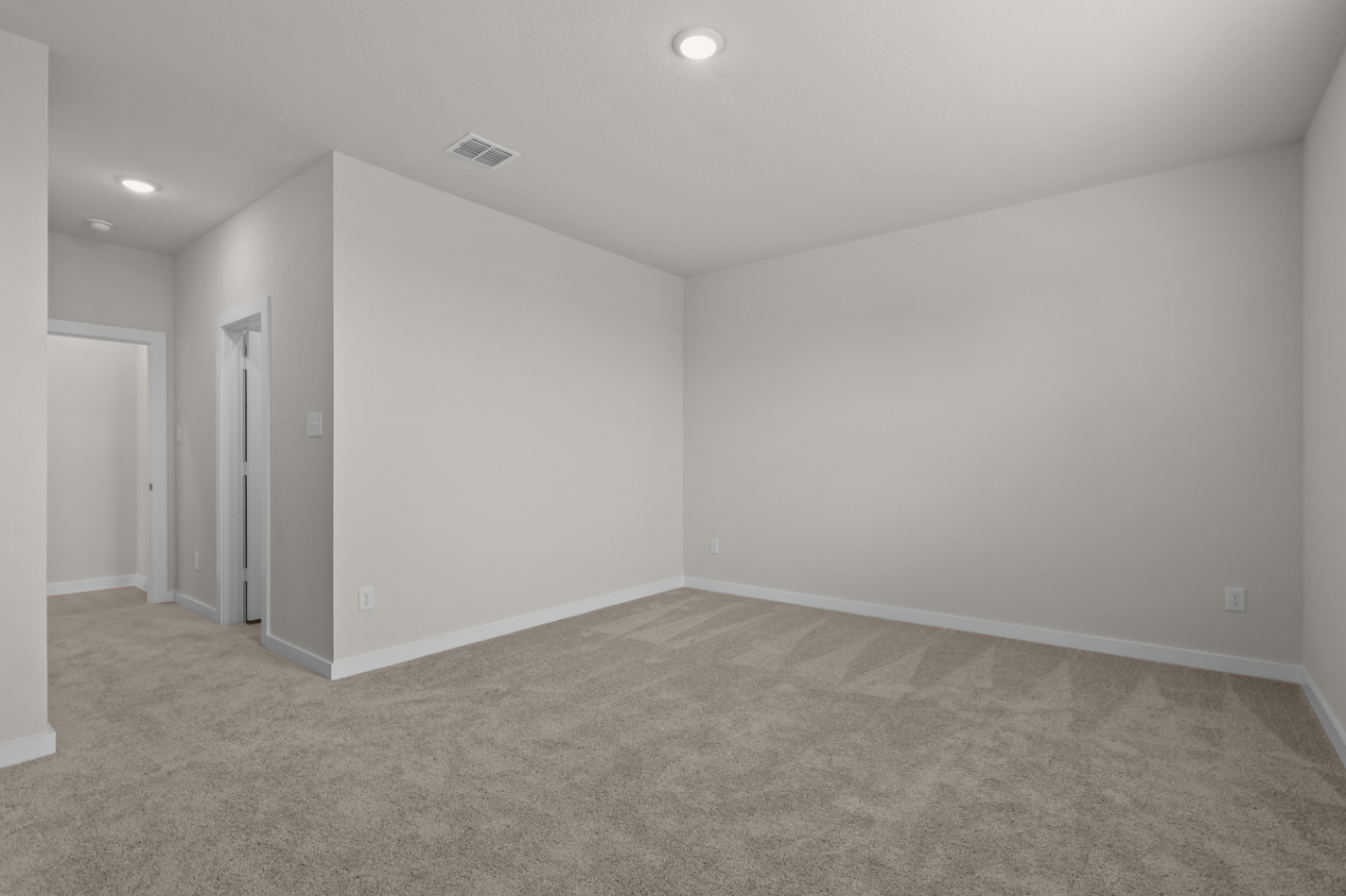 A room with a carpet and a carpet.