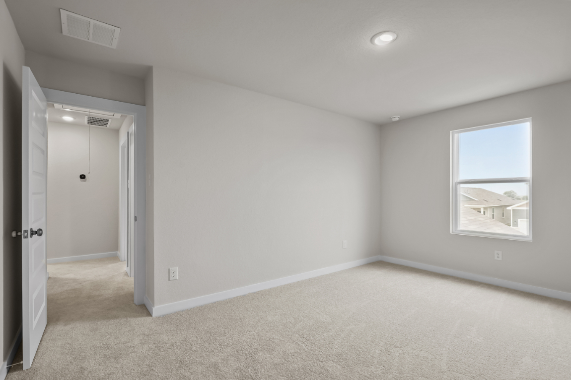 A room with a window and a door.