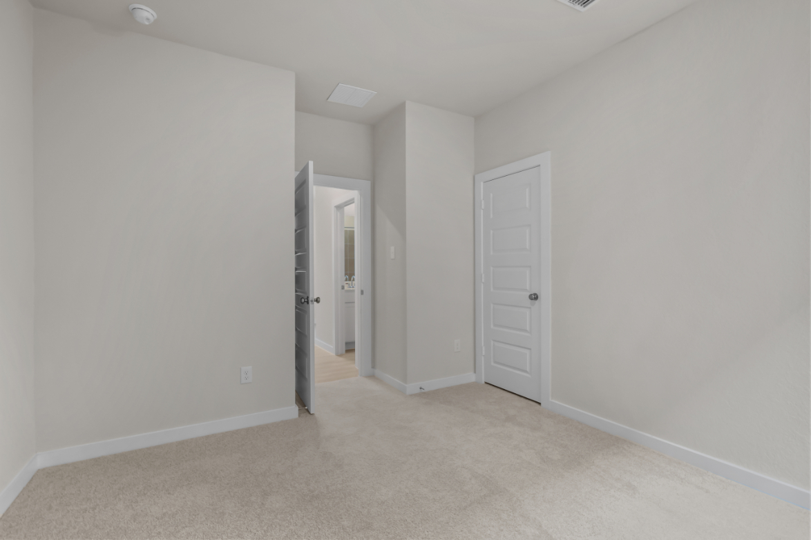A hallway with white walls.
