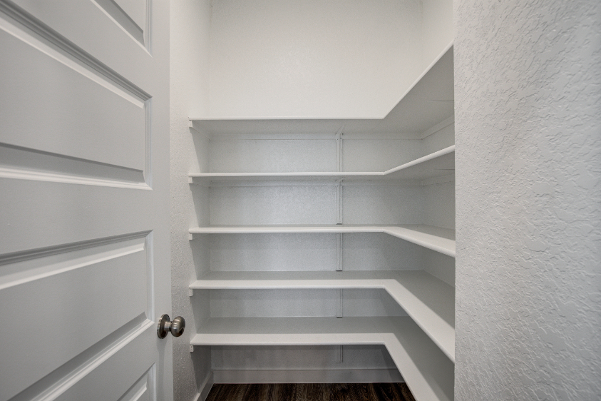 A white shelf with white doors.