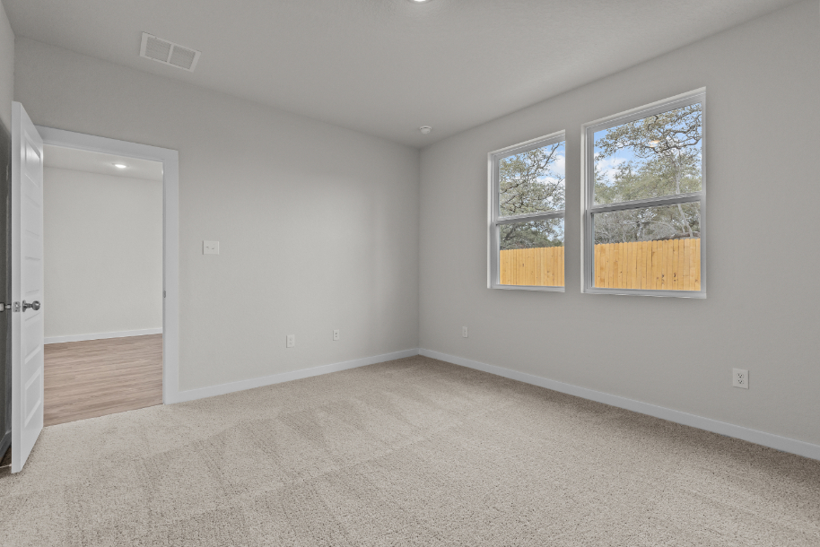 A room with a window and a door.