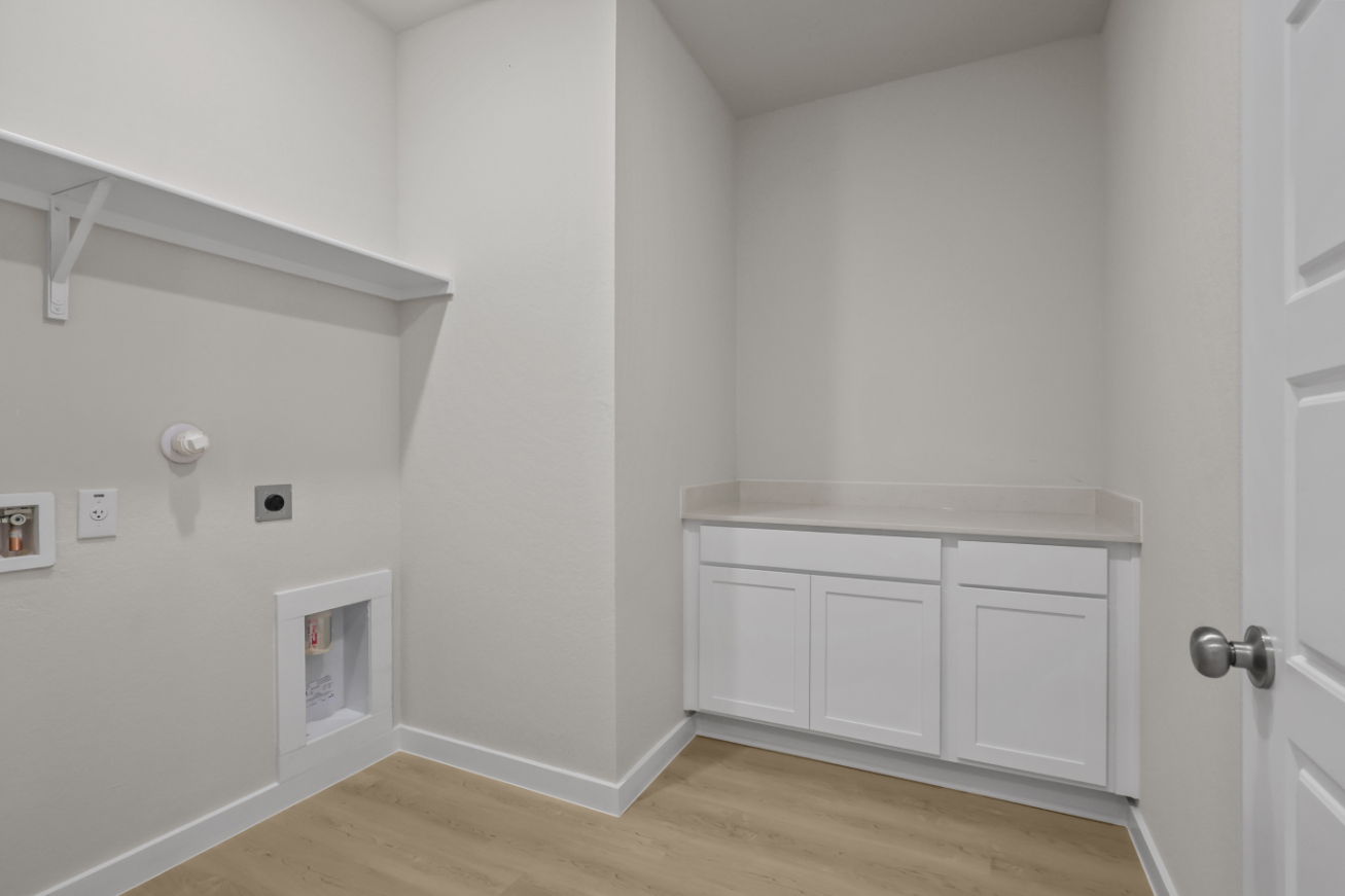 A room with white cabinets.