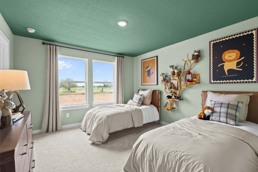 A bedroom with two beds.