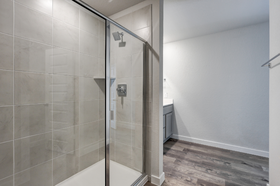 A shower with a glass door.