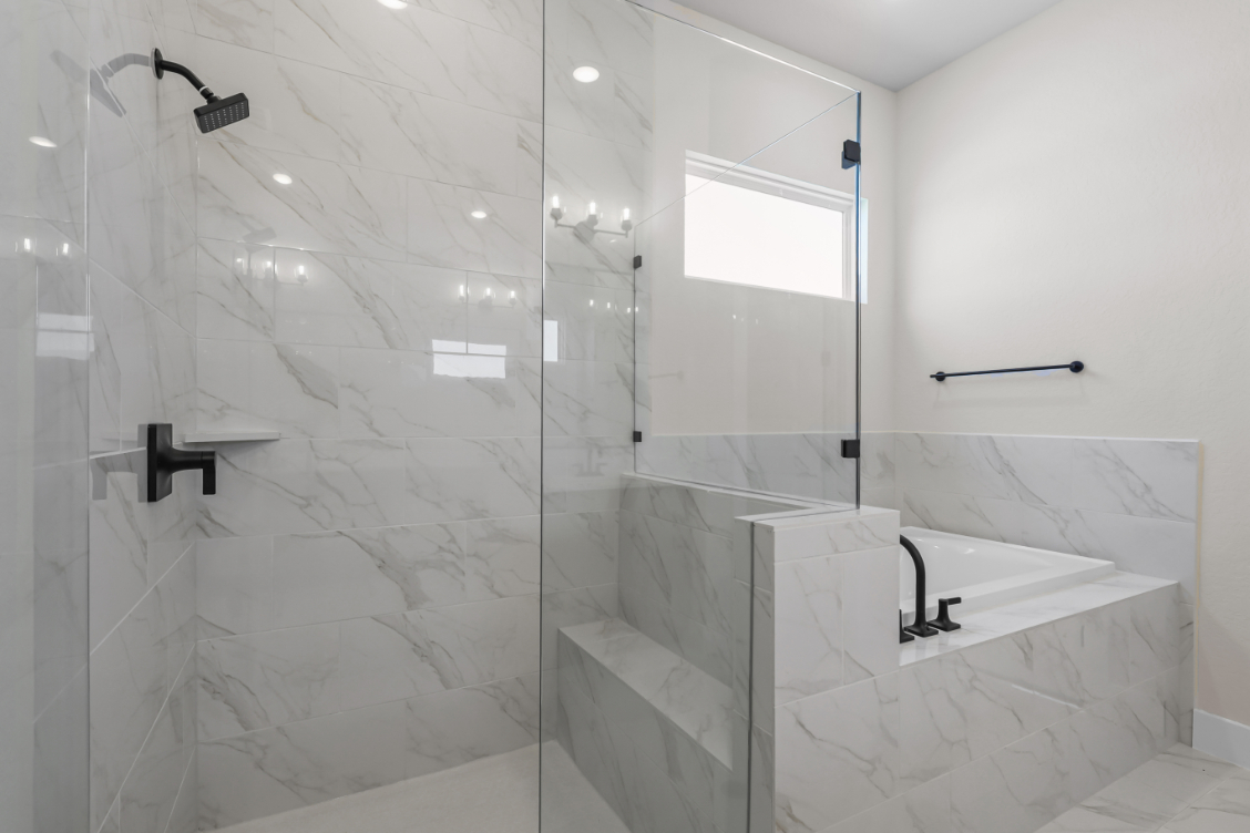 A bathroom with a glass shower.
