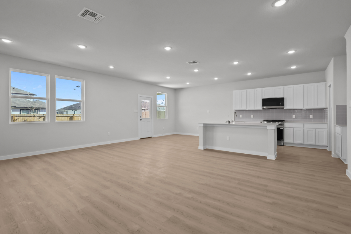 A large kitchen with white cabinets.