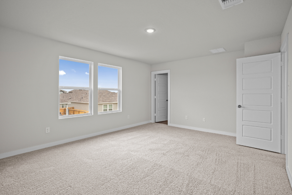 A room with a window and a door.