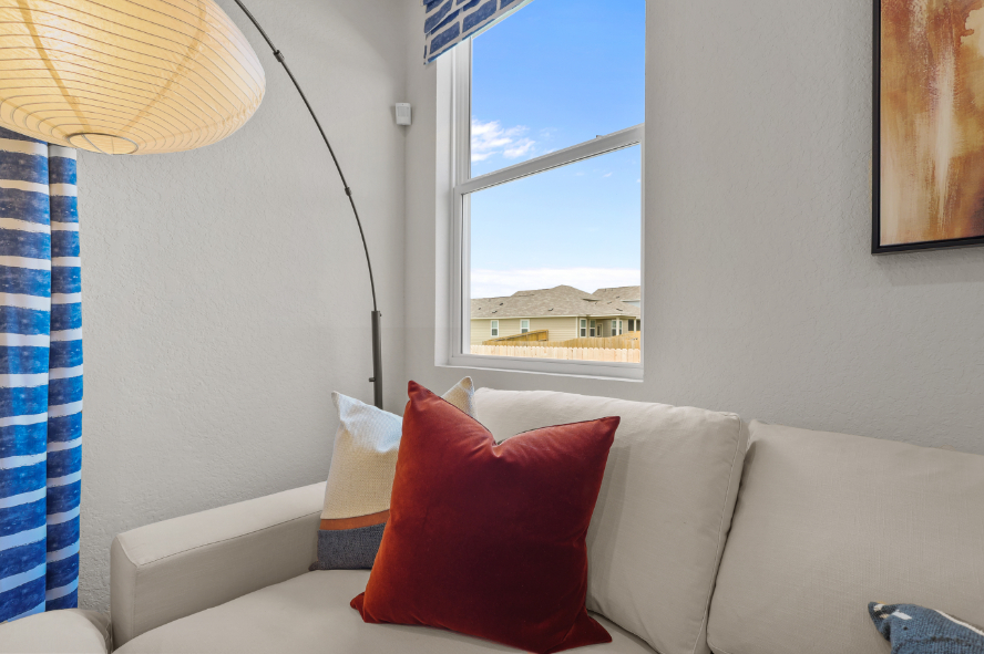 A couch with pillows.