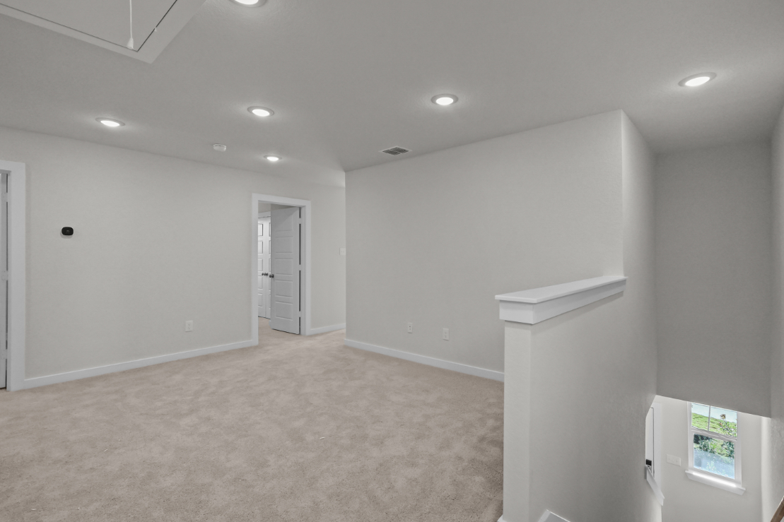 A room with white walls and a white wall with a sign on it.