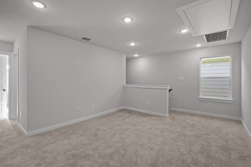 A room with a white wall and a white floor.