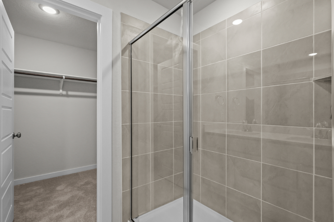 A shower with glass doors.