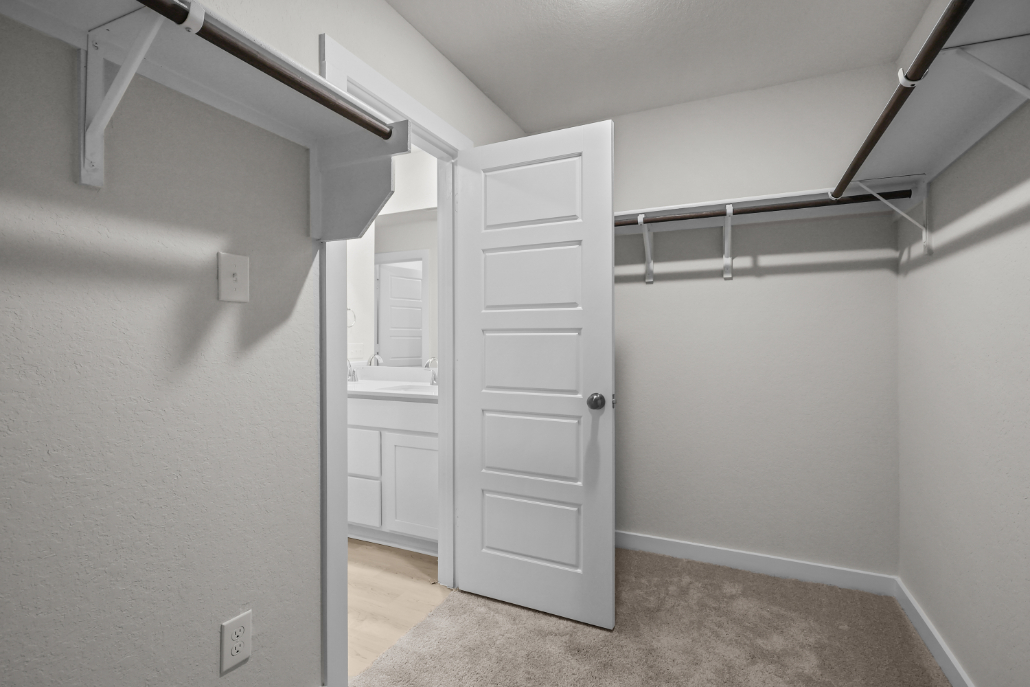 A white room with a white door.