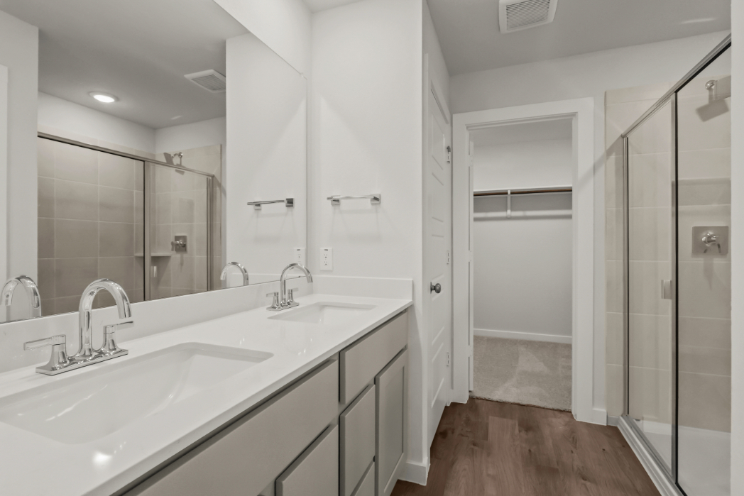 A bathroom with a glass shower.